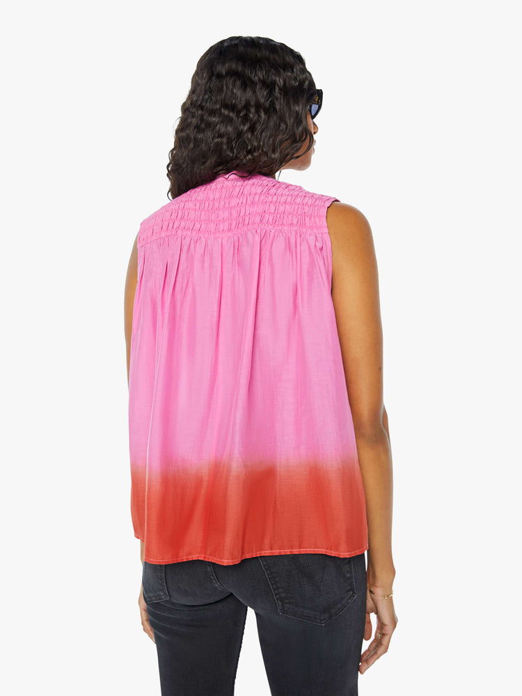 Back view of a womens sleeveless top featuring a v neck with tassels.