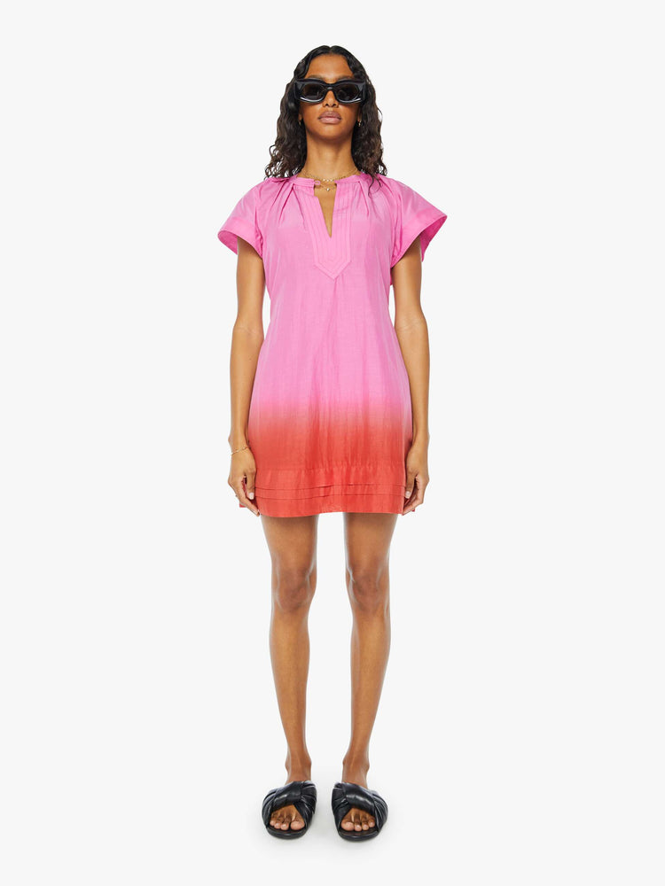 Front view of a womens short dress in a pink to red ombre, featuring short sleeves and a v neck.