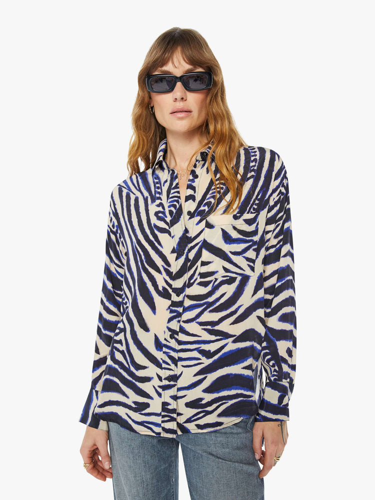 Front view of a womens long sleeve button down shirt featuring a zebra animal print.