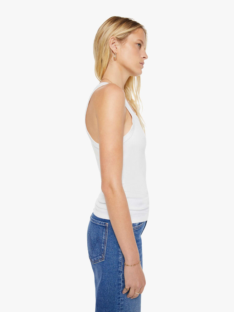 Side view of a womens fitted white tank.