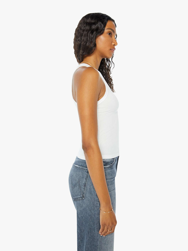 Side view of a womens fitted white tank.