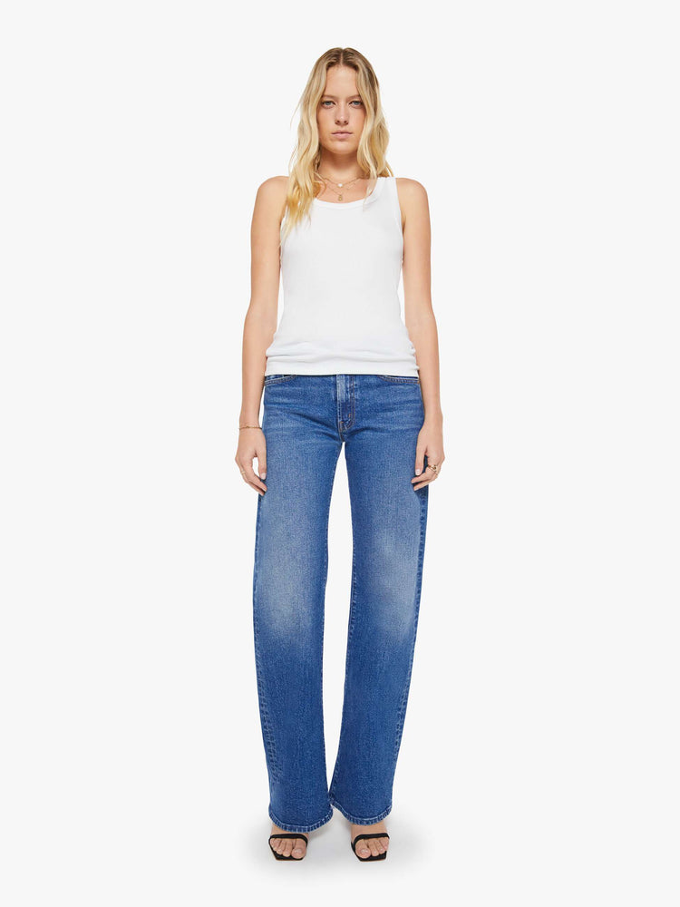 Full body view of a womens fitted white tank.