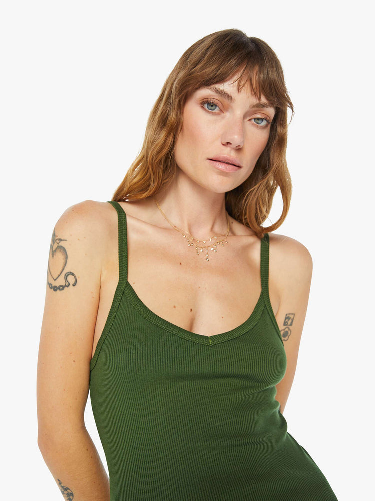 Front close up view of a womens fitted green tank.