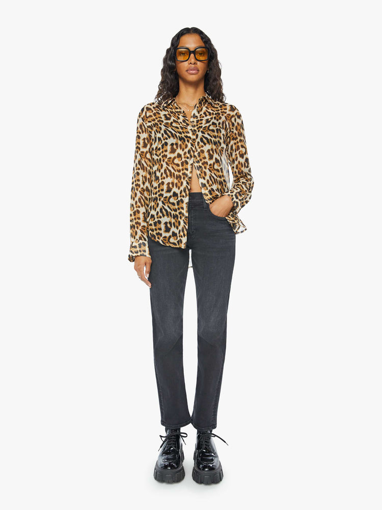 Front full body view of a womens sheer button down shirt featuring a leopard print.