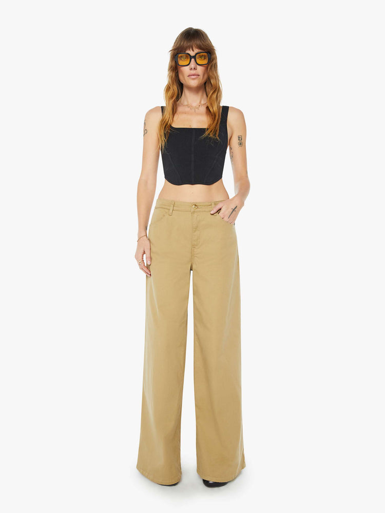 Front view of a womens brown pant featuring a relaxed mid rise and wide leg.