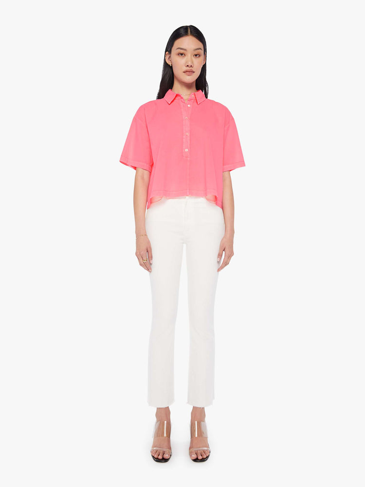 Front full body view of a womens neon pink collar shirt featuring a 3/4 length button, dropped short sleeves, and a cropped boxy fit.