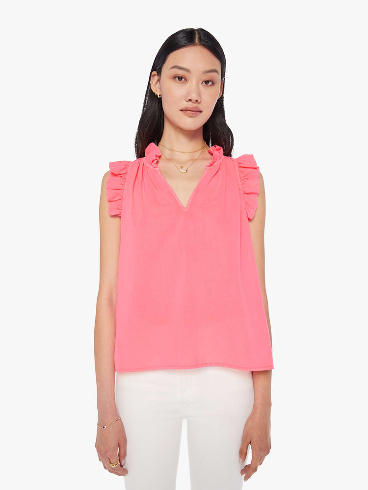 Front view of a womens neon pink blouse featuring sleeveless ruffles and a v neck.