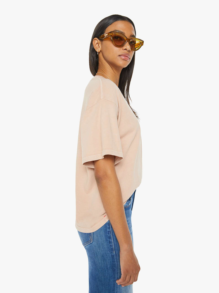 Side view of a womens crewneck tee in a soft shade of pink, the Palmer Tee features drop shoulders, oversized short sleeves and a boxy fit.