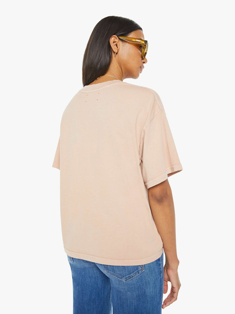 Back view of a womens crewneck tee in a soft shade of pink, the Palmer Tee features drop shoulders, oversized short sleeves and a boxy fit.