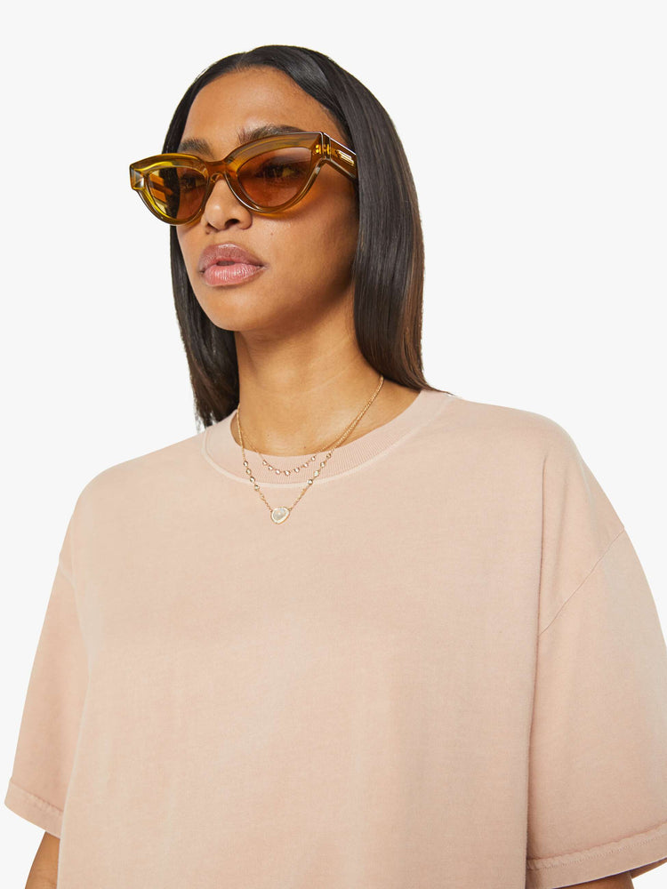 Close up view of a womens crewneck tee in a soft shade of pink, the Palmer Tee features drop shoulders, oversized short sleeves and a boxy fit.