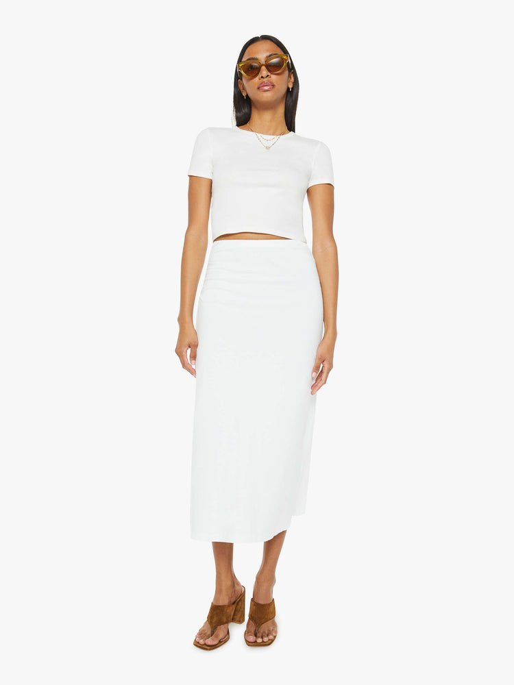 Front view of women maxi skirt in white, the Lenny skirt features a high rise, gathered waist and a slightly narrow fit.