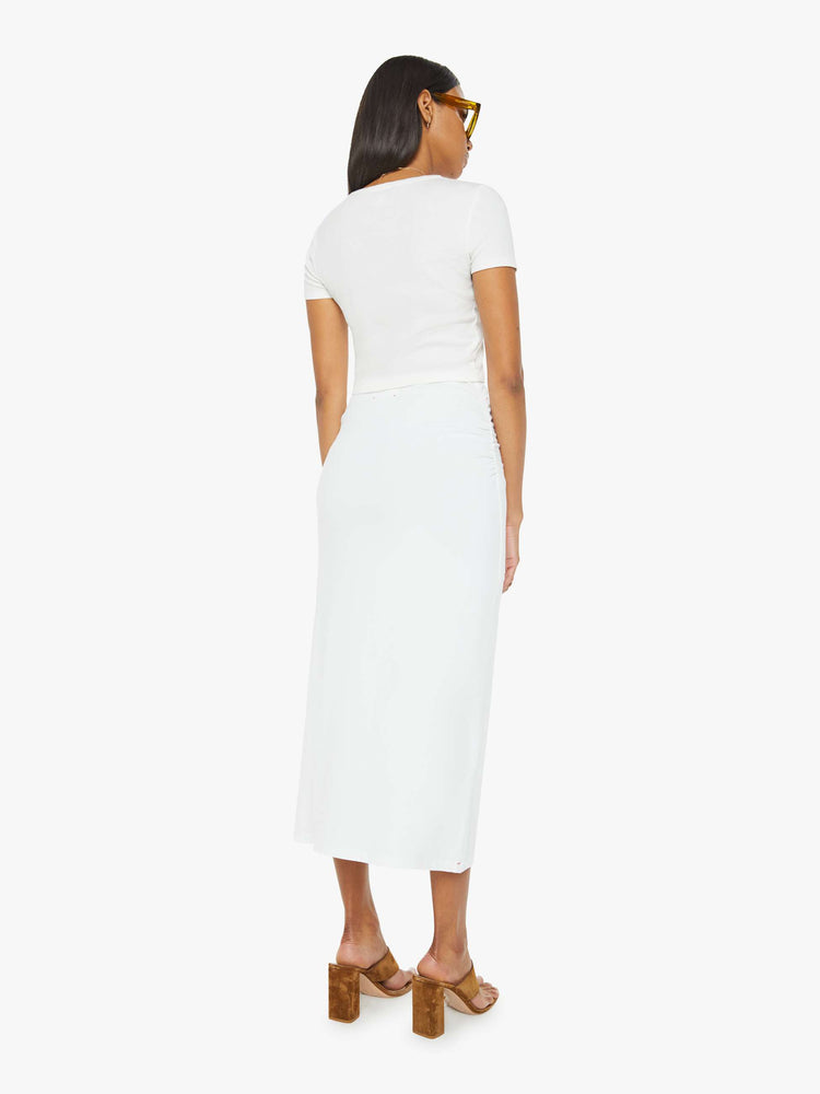Back view of women maxi skirt in white, the Lenny skirt features a high rise, gathered waist and a slightly narrow fit.