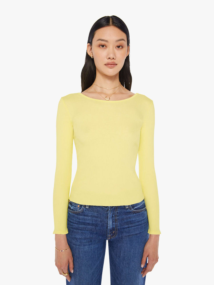 Front view of a womens light yellow fitted long sleeve tee featuring a scoop neck.