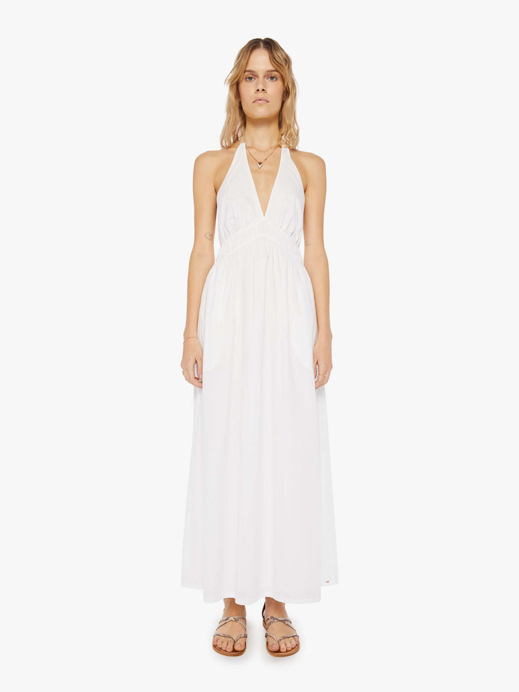 Front view of a womens white ankle length dress featuring a deep v halter neck and a full skirt.