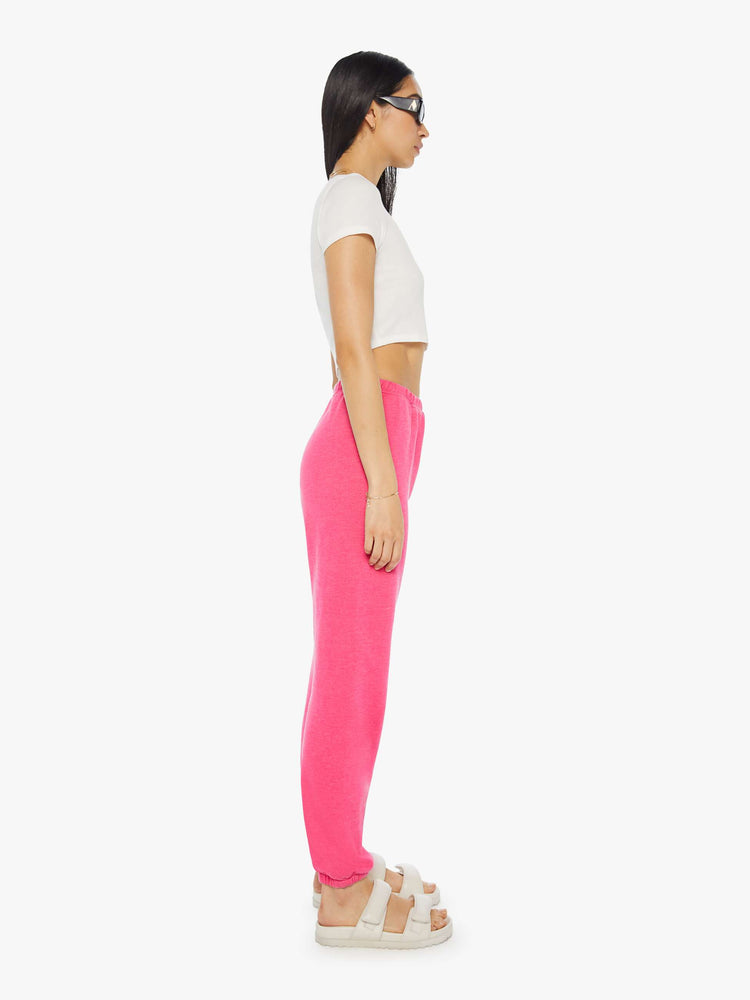 Side view of a womens hot pink sweatpant.