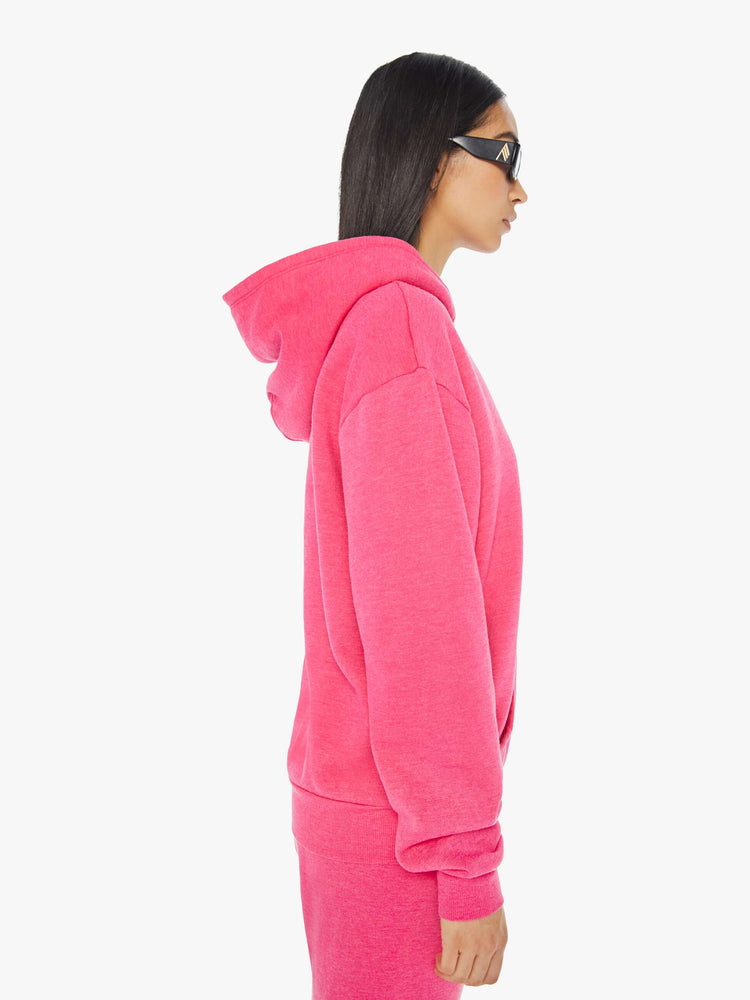 Side view of a womens hot pink sweatshirt hoodie featuring a front pocket.