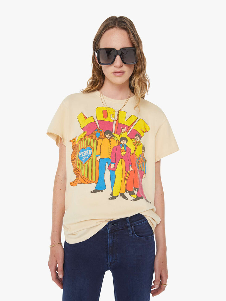WOMEN front view in a tea-stained white tee that pays homage to The Beatles with a colorful graphic on the front.