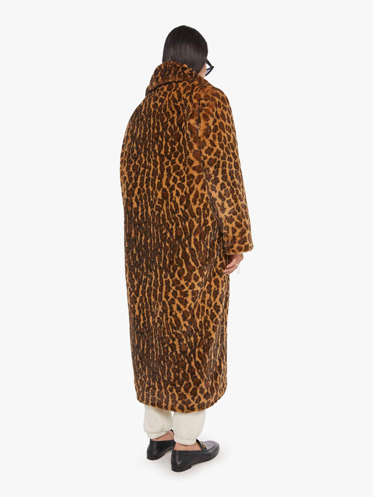 Back view of a woman in a coat with in leopard print.