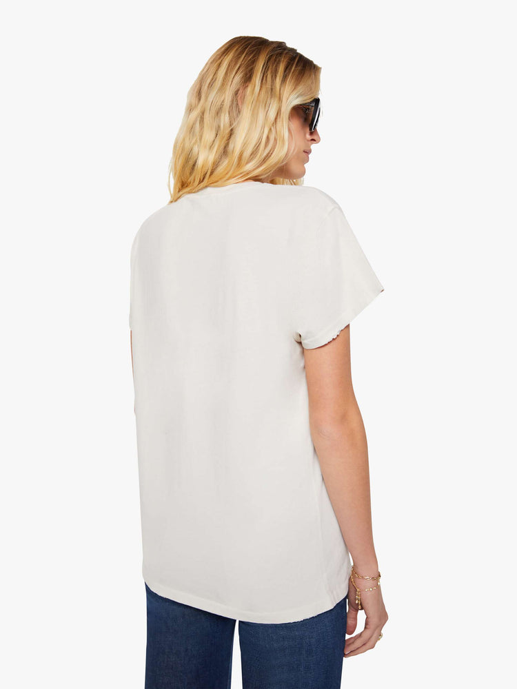 Back view of a woman in a white tee pays homage to Blondie with a black-and-white photograph and the band's name in red on the front.