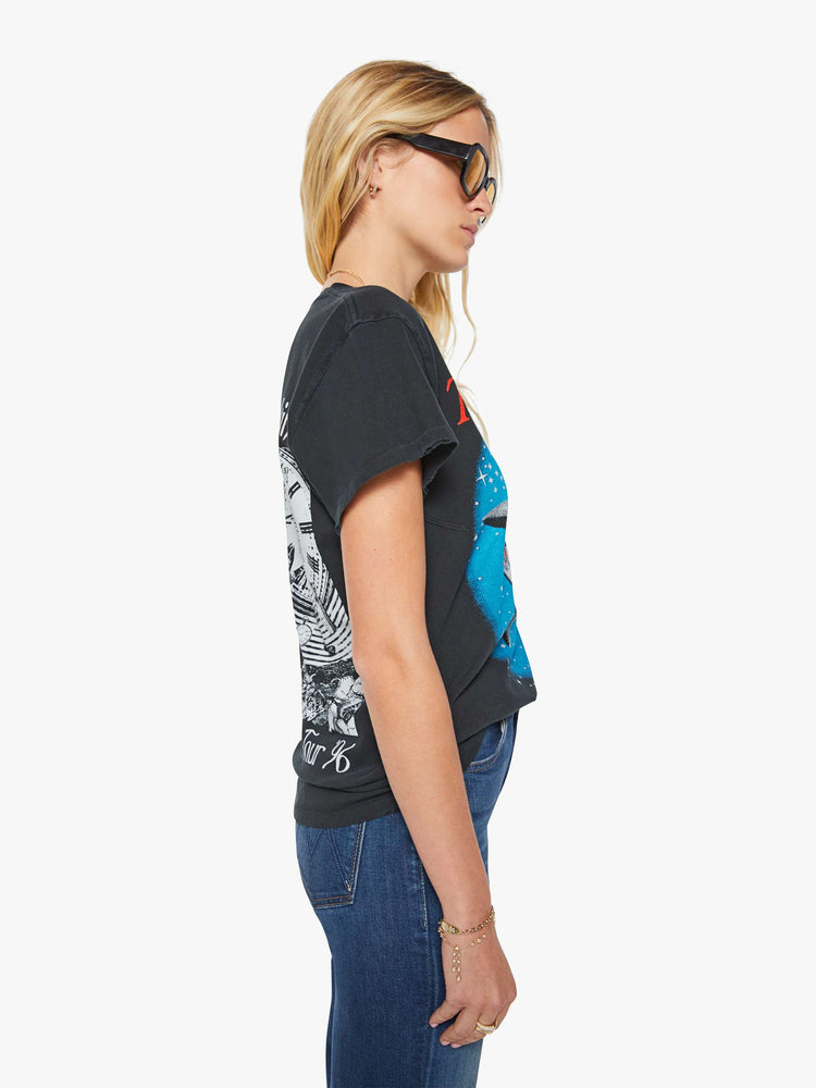 Side view of a woman in a black tee pays homage to The Smashing Pumpkins' 1995 album with a graphic portrait on the front and back.