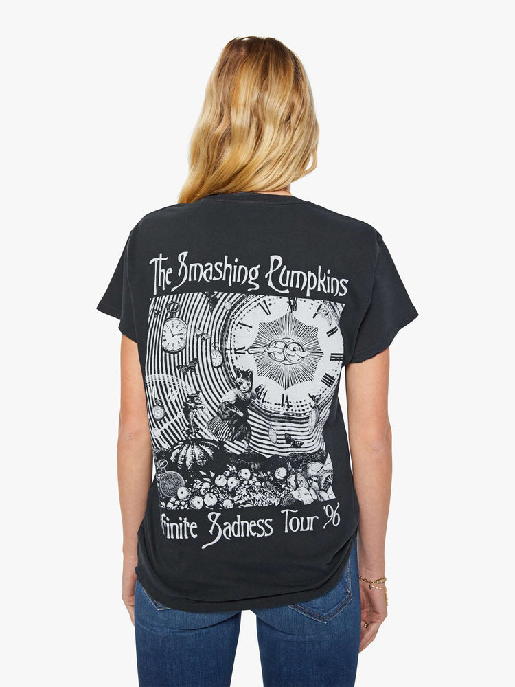 Back view of a woman in a black tee pays homage to The Smashing Pumpkins' 1995 album with a graphic portrait on the front and back.