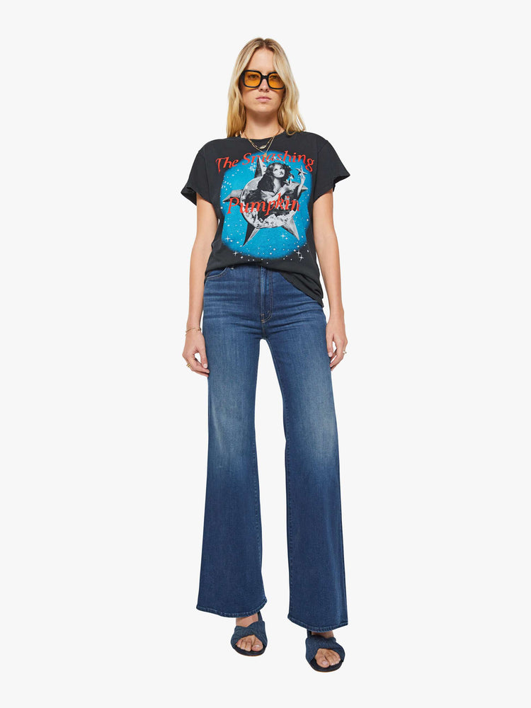 Full body view of a woman in a black tee pays homage to The Smashing Pumpkins' 1995 album with a graphic portrait on the front and back.