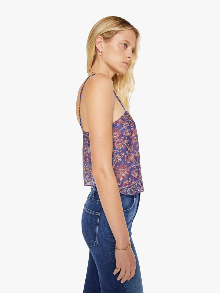Side view of a woman in a blue and pink floral print, the Fern cami has a square neck, spaghetti straps and a cropped, boxy fit.
