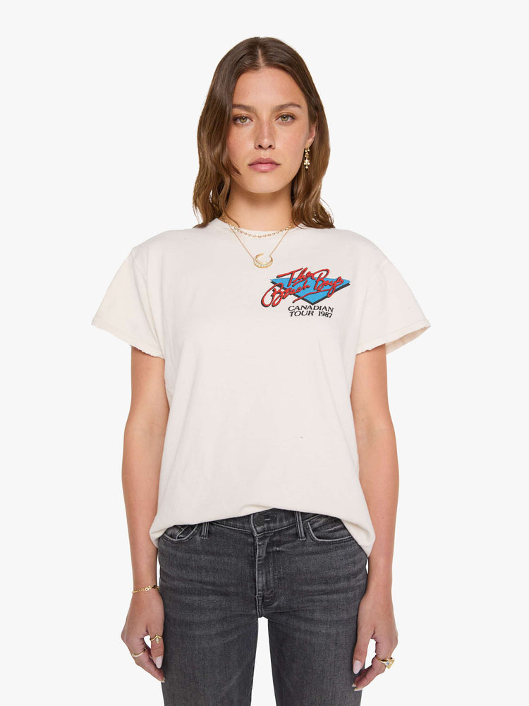 Front view of a woman in a off-white tee pays homage to The Beach Boys with a colorful graphic on the front and back.