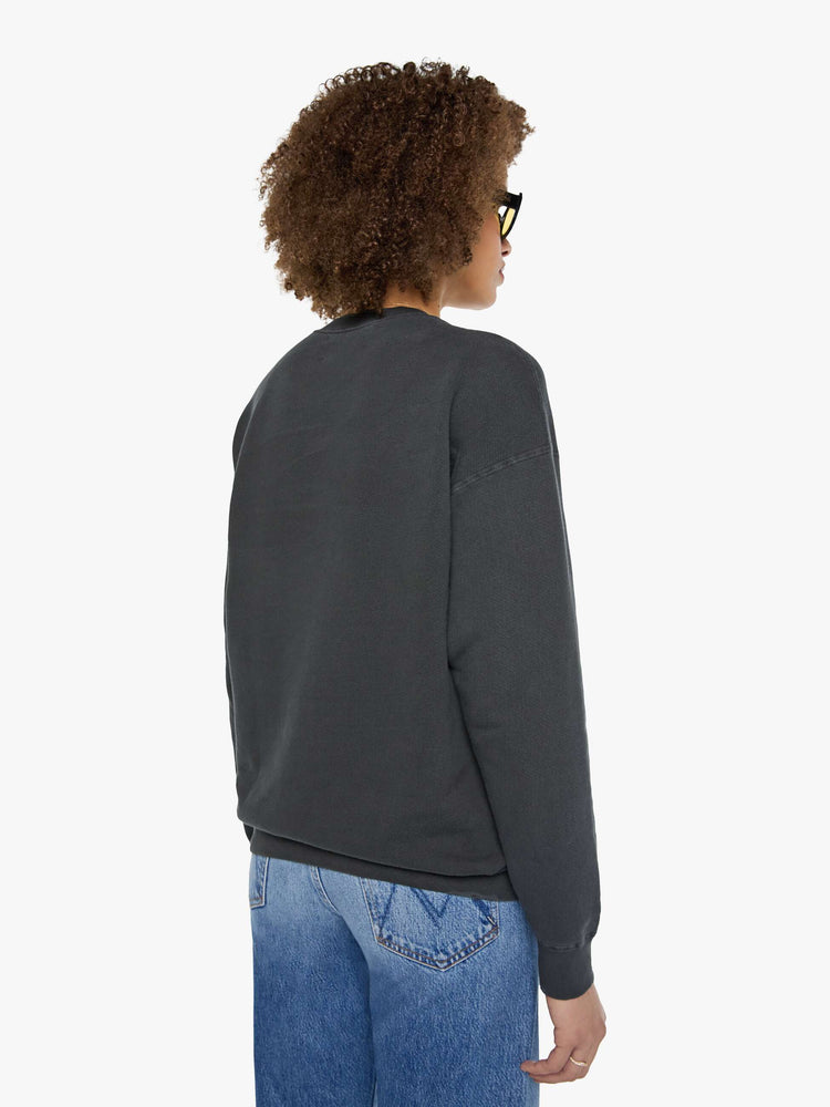 Back view of a woman in a faded black sweatshirt pays homage to The Ramones' eleventh studio album with a cream graphic and the band's name in purple on the front.