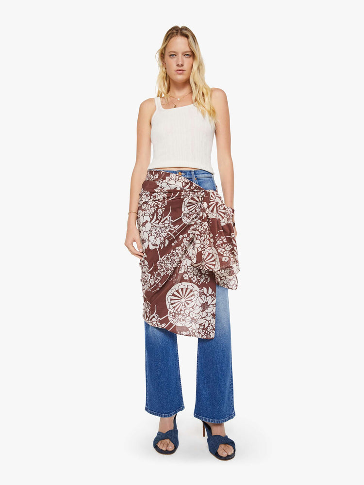 Side view of a woman in a brown with a white vintage-inspired print scarf, can be worn as a dress, top, skirt or accessory.