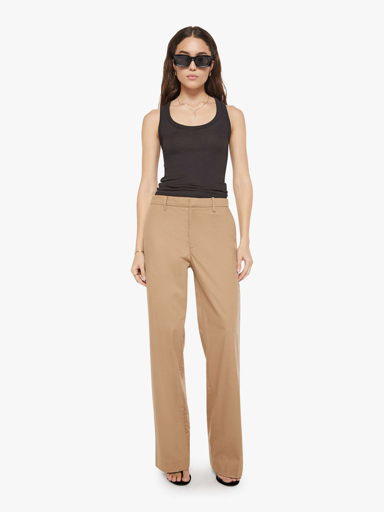 Front view of a woman in khaki trousers from the Los Angeles brand SPRWMN (pronounced "superwoman") have a straight leg, long inseam and a loose, comfortable fit.