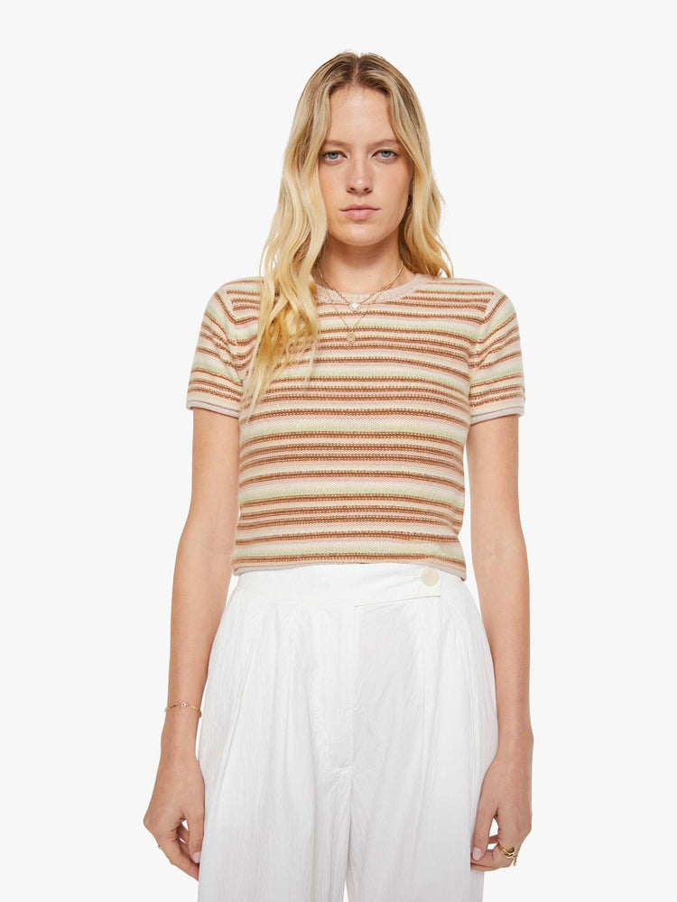 Front view of a woman in a warm-toned stripes, the Jude tee is designed with a crewneck, short sleeves and a slightly shrunken fit.