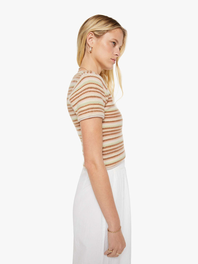 Side view of a woman in a warm-toned stripes, the Jude tee is designed with a crewneck, short sleeves and a slightly shrunken fit.