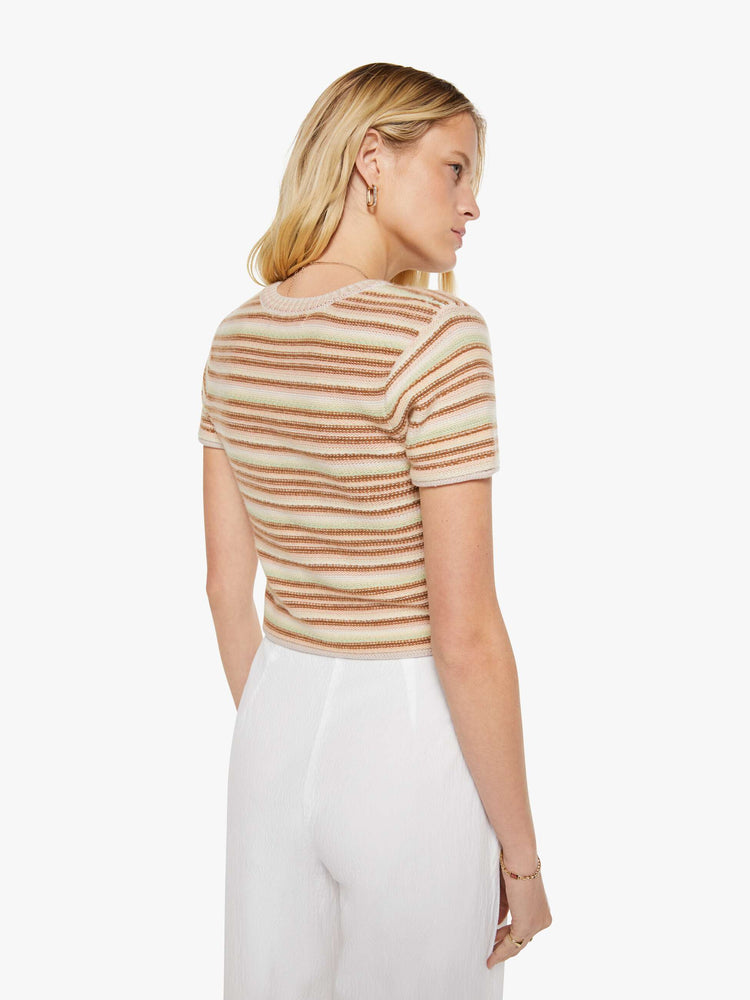 Back view of a woman in a warm-toned stripes, the Jude tee is designed with a crewneck, short sleeves and a slightly shrunken fit.