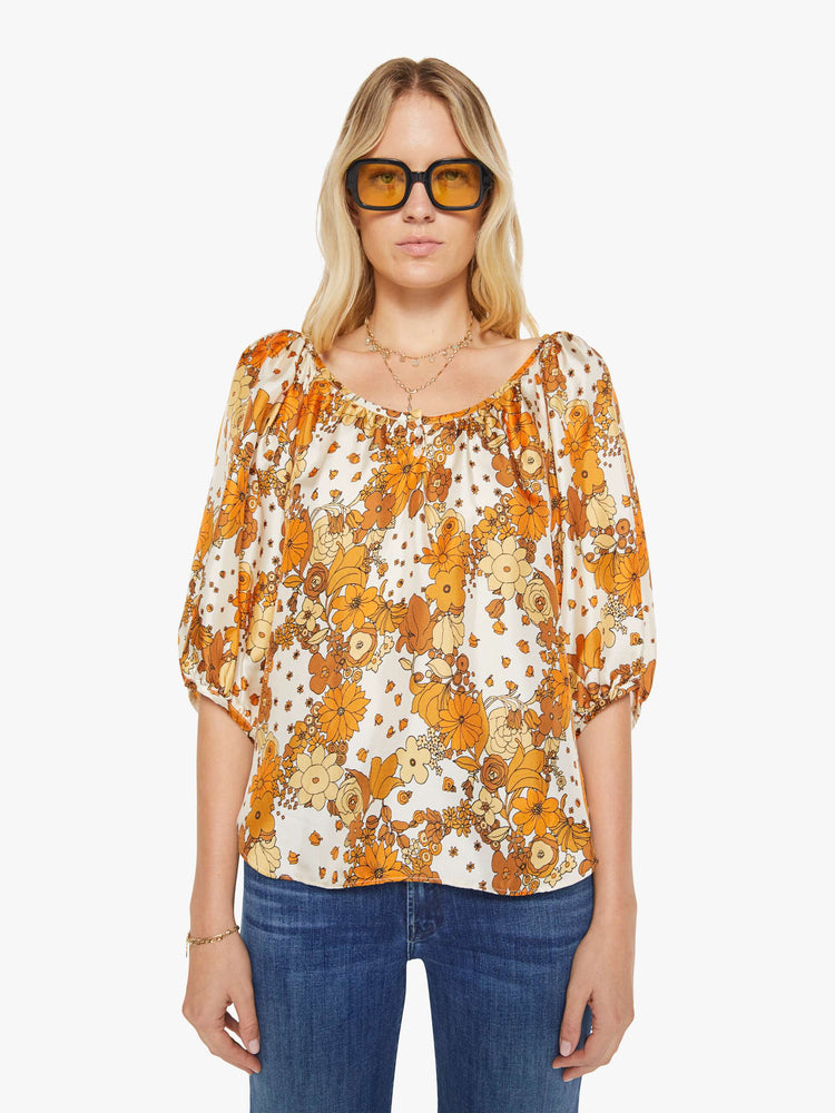 Front view of a woman in a vintage-inspired prints with classic silhouettes, featuring 3/4-length balloon sleeves and a flowy fit.