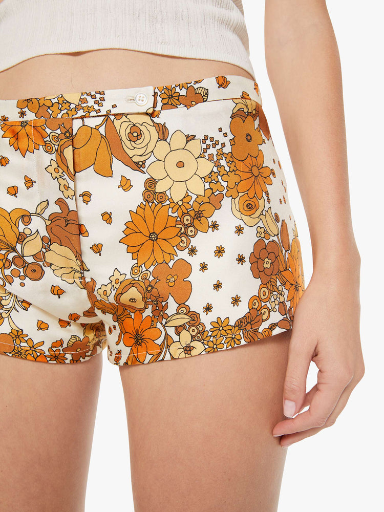 Close up view of a woman in a floral print low-rise micro shorts.