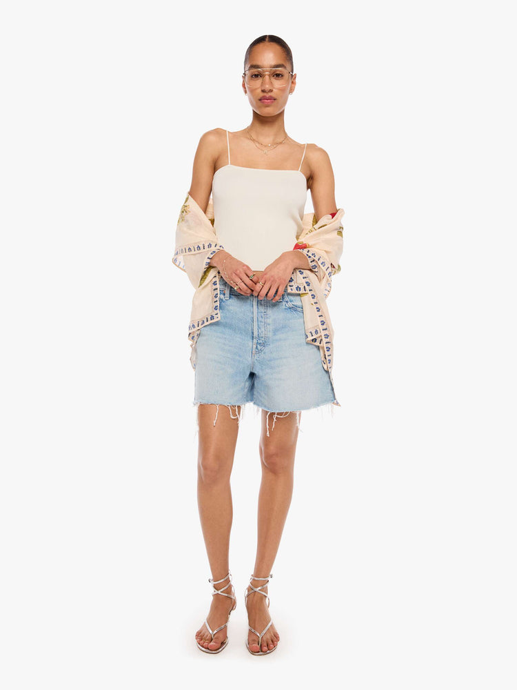 Model wearing cream scarf with an oversized fruit print, and can be worn as a dress, top, skirt or accessory.