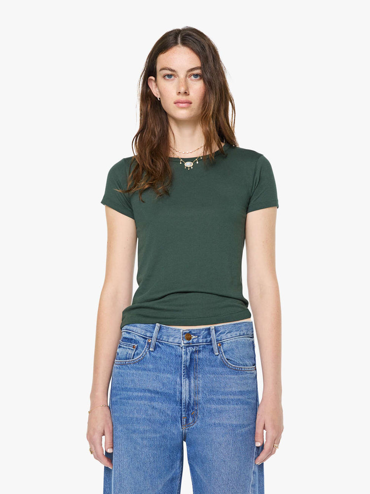 Front view of a woman in a forest green crewneck tee is designed with short sleeves and a narrow fit.