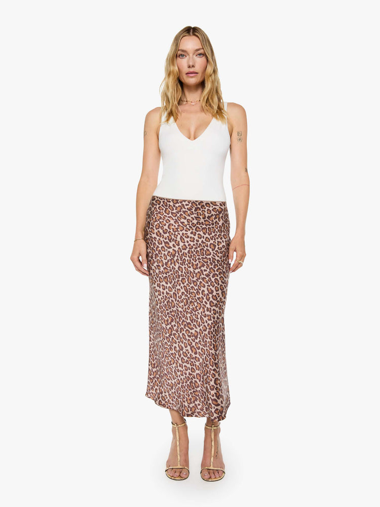Front view of a woman in a cheetah print maxi skirt is designed with a straight fit and a flowy ankle-grazing hem.