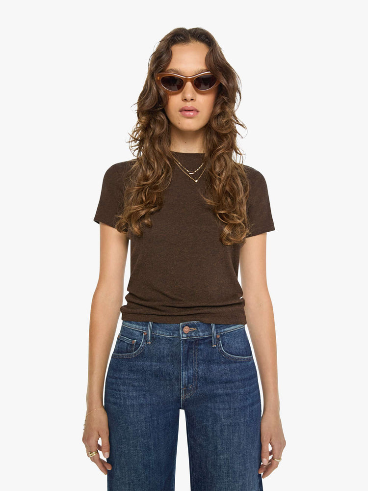Front view of a woman in a brown baby tee from SPRWMN with a hip-length hem, short sleeves and a semi-fitted shape.