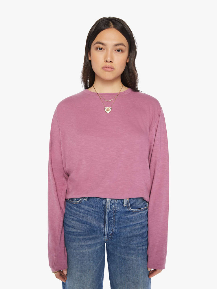Front view of a woman plum long-sleeve crewneck with a slightly boxy shape.