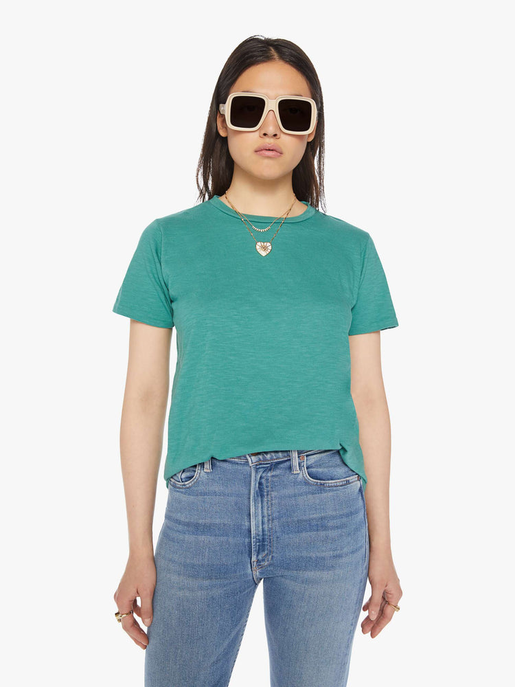 Front view of a woman faded green crewneck with a slightly boxy shape.