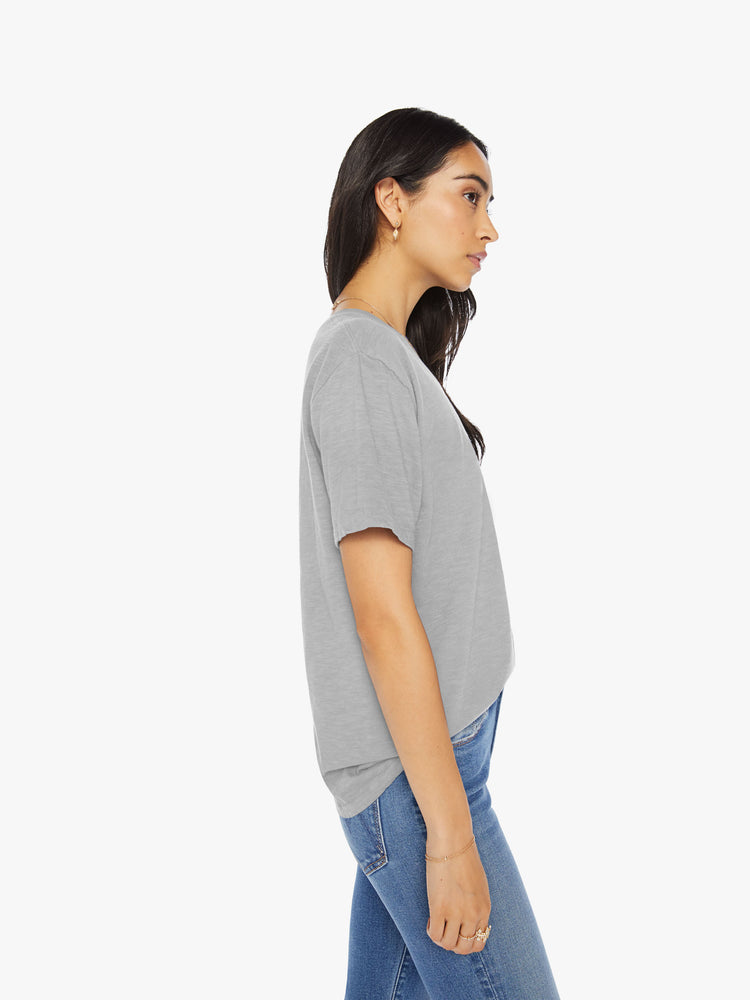 Side view of a womens grey crew neck tee.