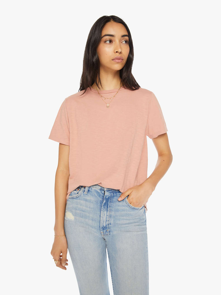 Front view of a woman crewneck in a faded peach tee with a slightly boxy shape.