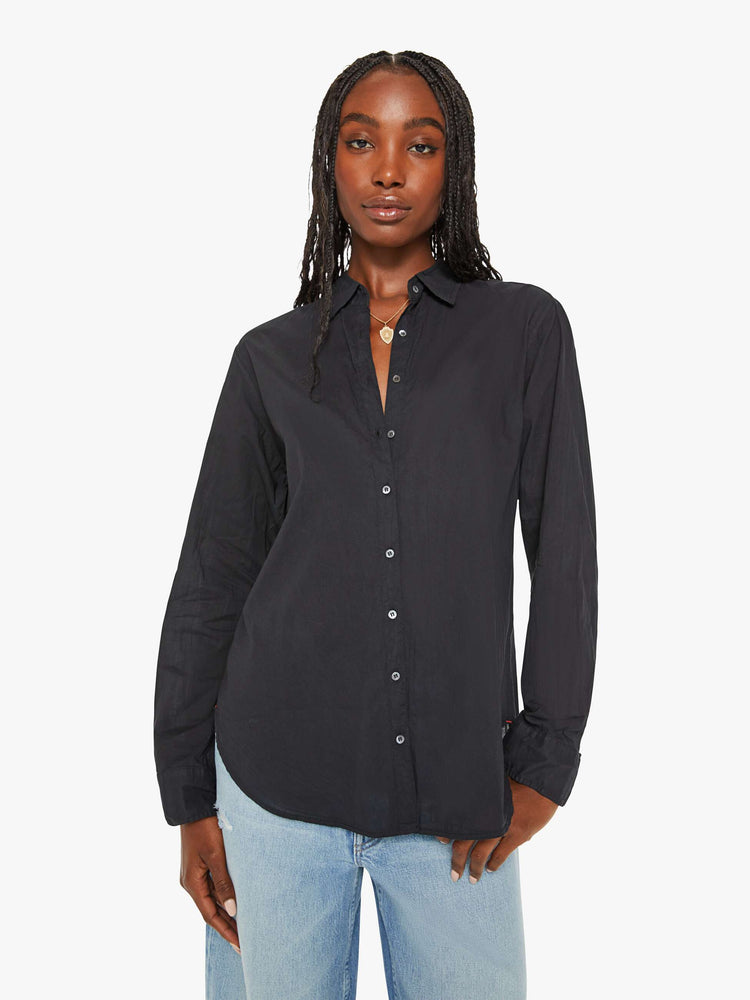 Front view of a woman black button-down long sleeve shirt is light and airy with a loose fit. 