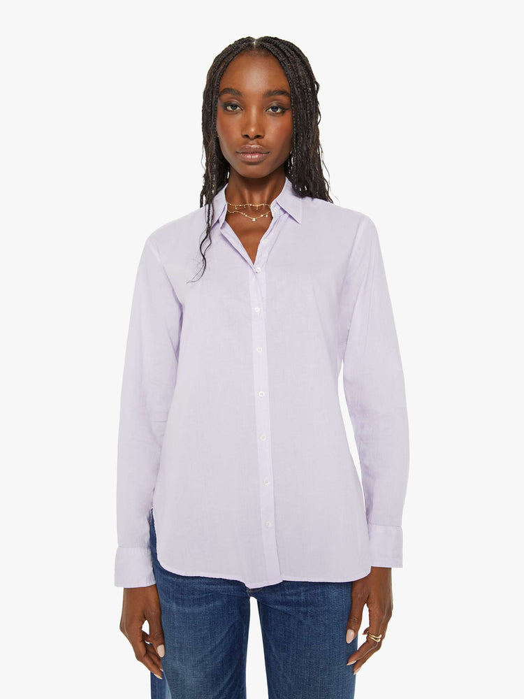 Front view of a woman light-blue button-down long sleeve shirt is light and airy with a loose fit.