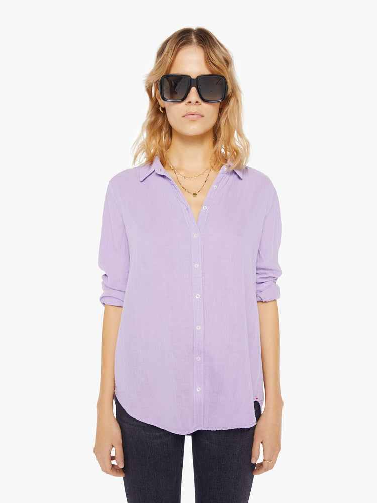 Front view of a womens light purple button down long sleeve shirt.