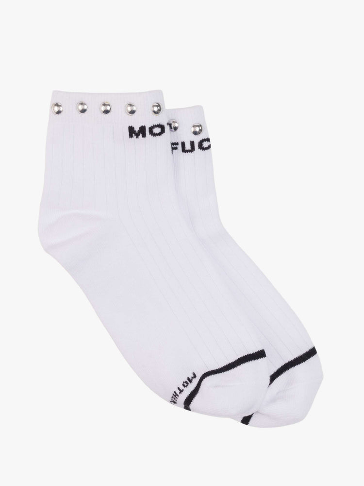 Flat view of a MOTHER's classic black and white tube sock now in an ankle style with metal studs along the hem.