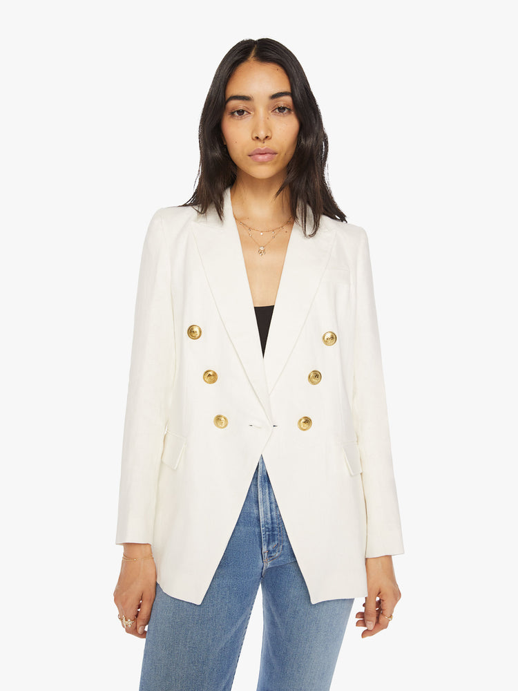 Front view of woman white v-neck blazer with an extra-wide collar, padded shoulders and a button closure.