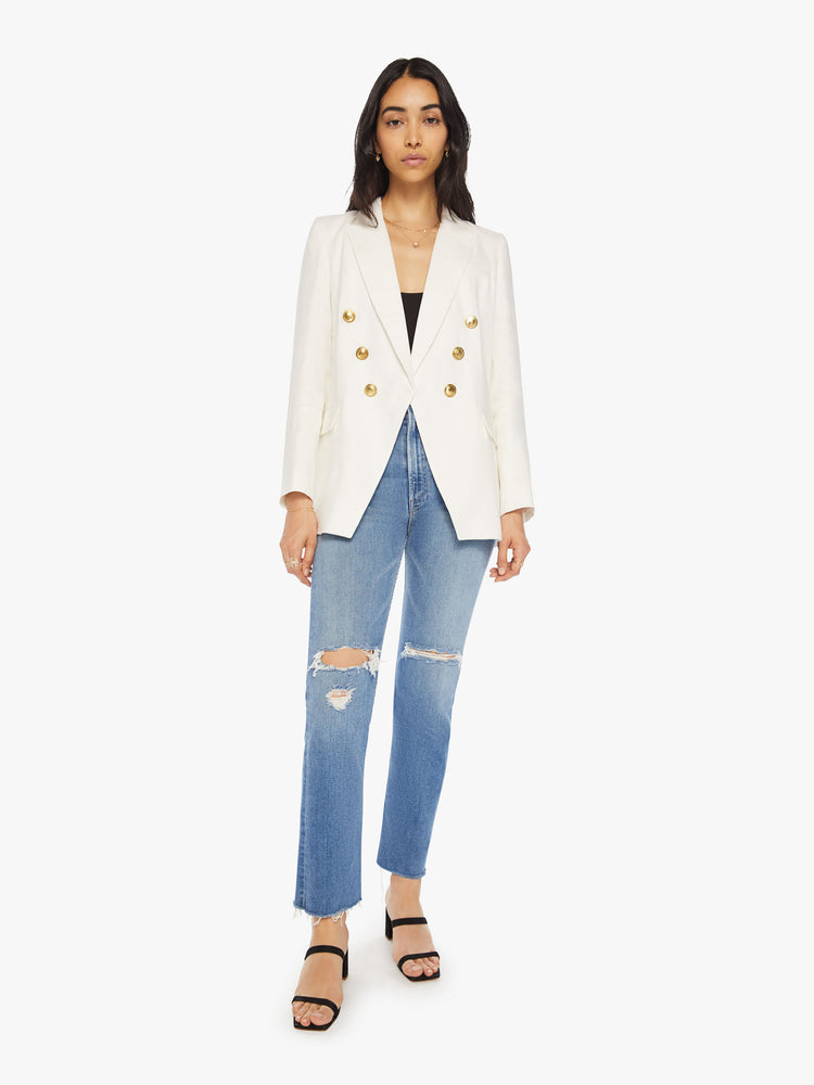Full body view of woman white v-neck blazer with an extra-wide collar, padded shoulders and a button closure.